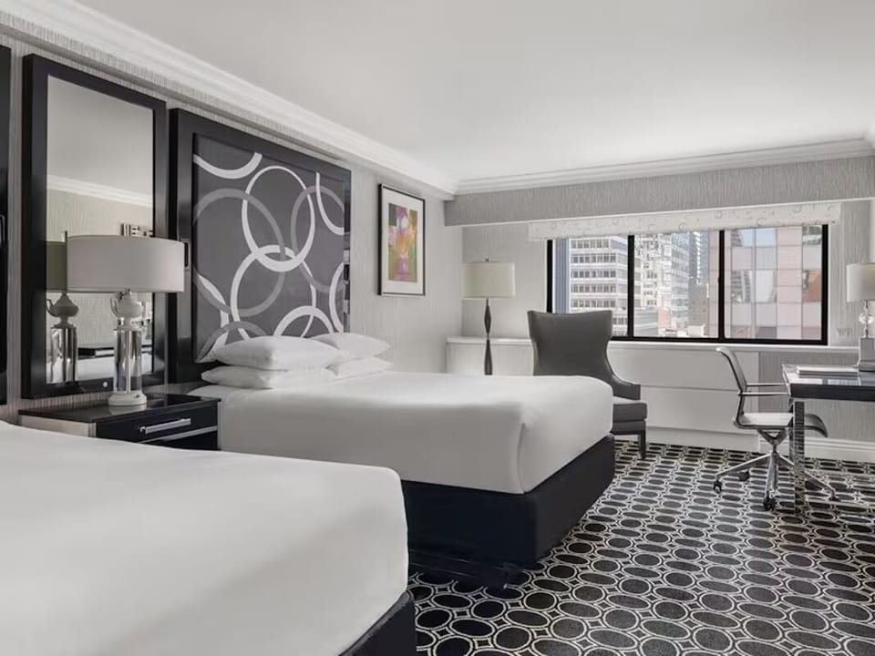 Drift off in a serene room with modern elegance.