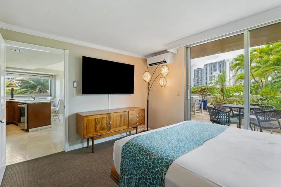 Unwind with your favorite shows and breezy patio access.