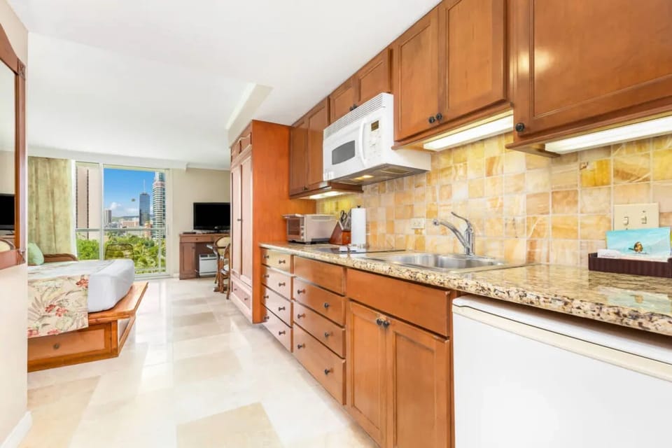 Prepare quick bites in the convenient kitchenette with granite counters.