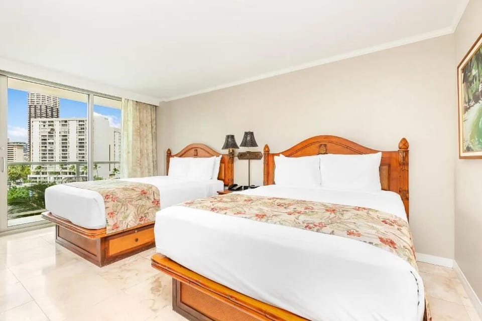 Settle into two plush beds for effortless shared comfort.