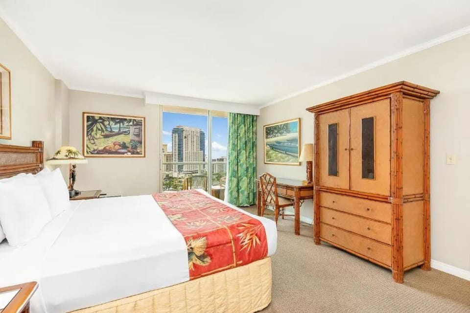 Unwind in a bright bedroom with skyline views.