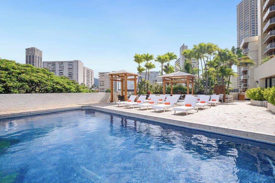Stretch out by the water with skyline views beyond.
