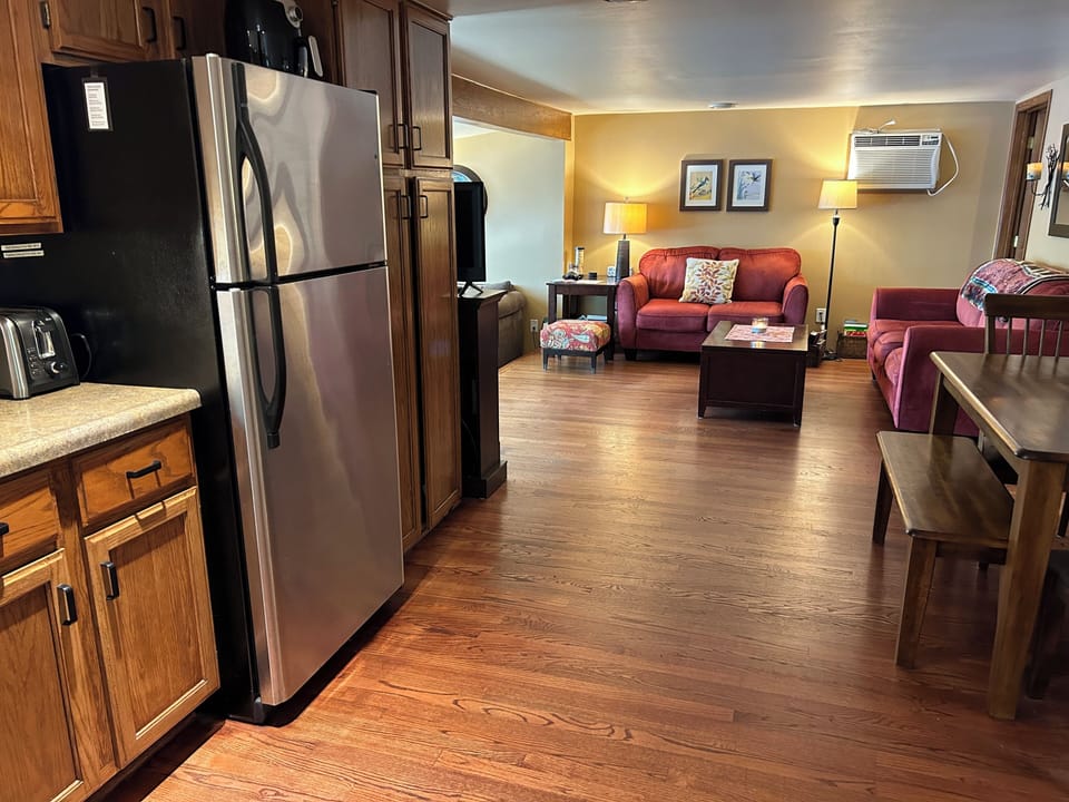 Dining table has two chairs and two benches