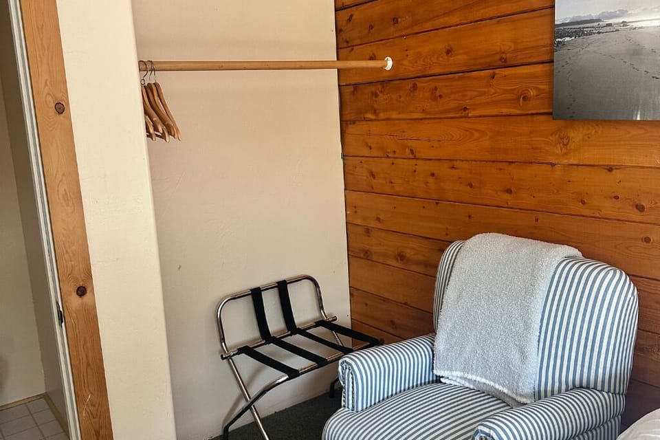 The room features storage for your luggage and belongings. 