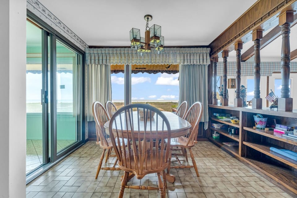 This sunroom is pure relaxation. Grab a book or just watch the waves roll in.