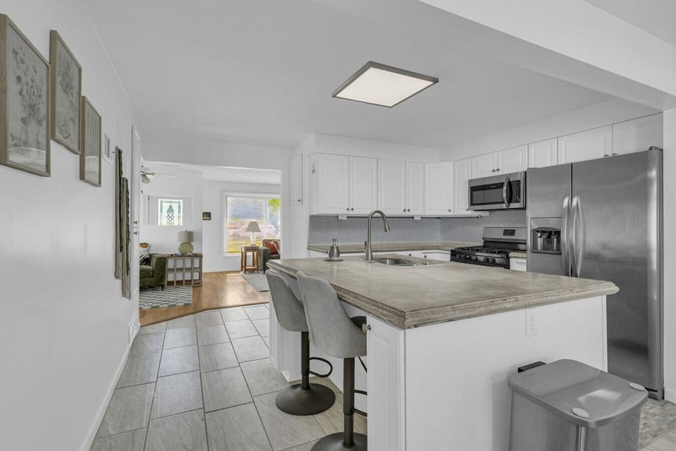 A peek from the kitchen looking into the cozy living space — open layout with good vibes only