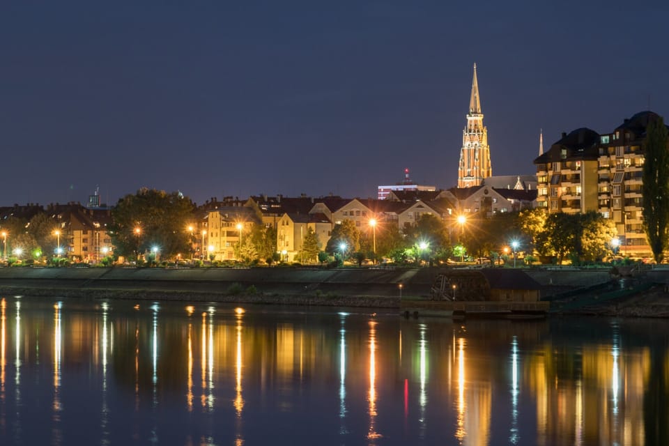 River Drava coast reflection by night