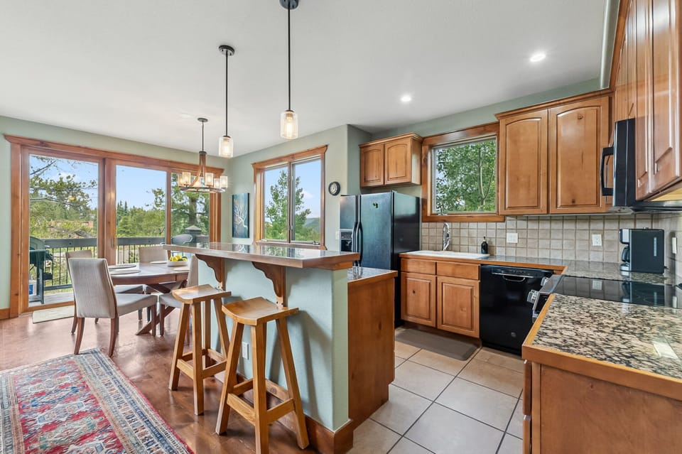 Kitchen: Main floor, drip coffee maker, toaster, blender, cooking utensils, tableware