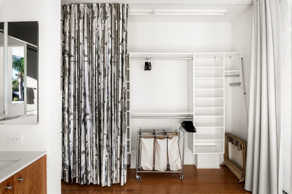 Well-maintained bathroom fully equipped with essentials and convenient closets.