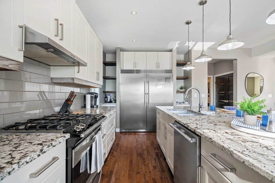 Open-concept kitchen with high-end finishes and space for all