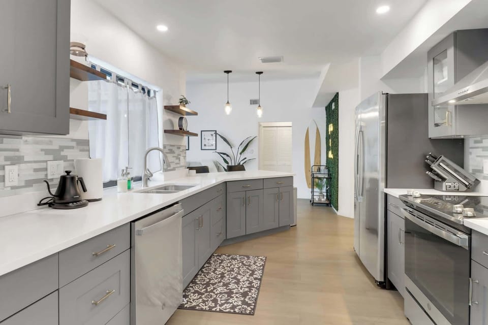 From morning coffee to family dinners—this kitchen does it all. Enjoy high-end appliances, a spacious island with seating, and all the tools you need in this fully stocked culinary space.