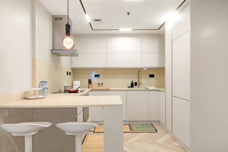 Sleek Kitchen: Modern design meets culinary adventure in this bright, functional space!