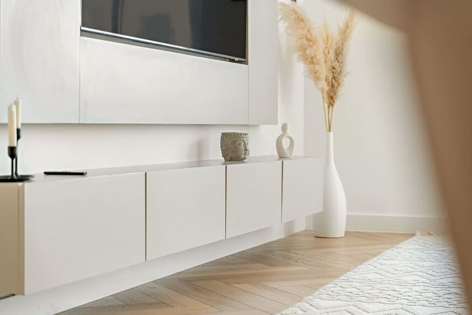 Living Room: Stylish decor with sleek furniture and vibrant accents awaits your relaxation!
