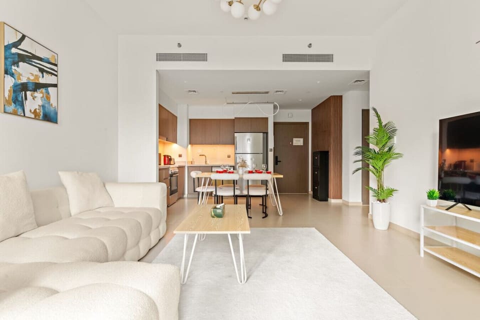Living Room: Sleek design meets comfort with a sunny vibe and modern amenities for ultimate relaxation!