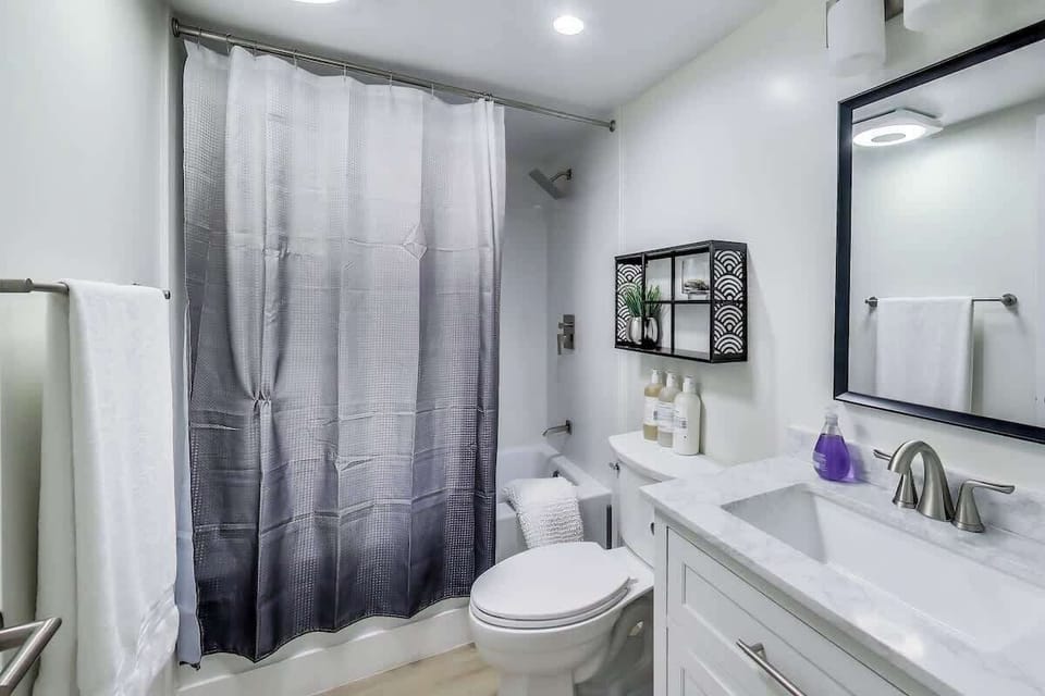 full bathroom  has everything you need for a refreshing morning shower including Kiehl's shampoo, conditioner, and body wash