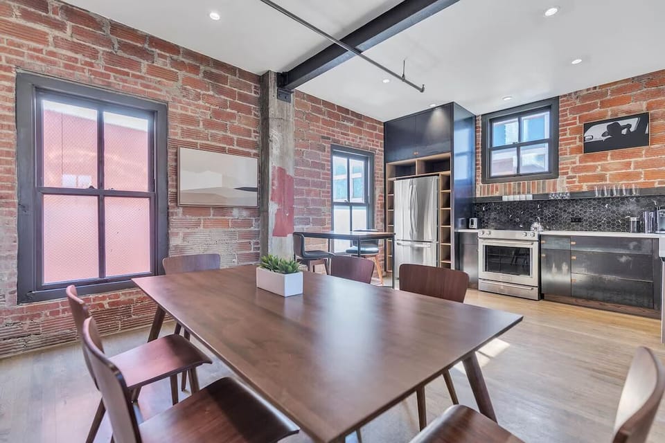 Gather over long dinners in a sunlit industrial loft.