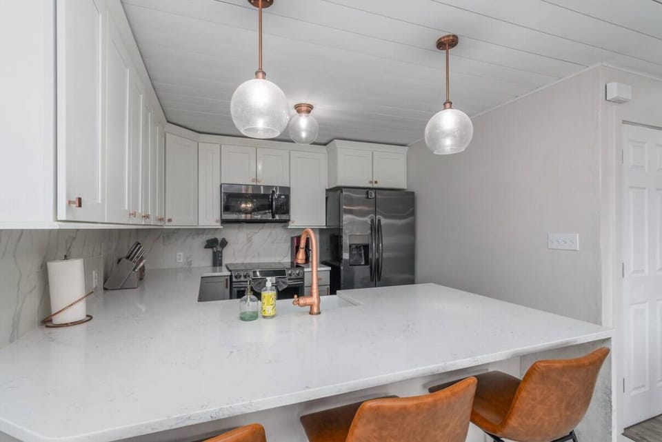 Fully equipped modern kitchen with sleek appliances and plenty of counter space for home-cooked meals.