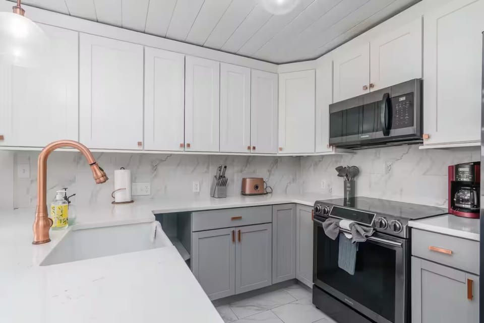 Bright, fully stocked kitchen ready for all your cooking needs—perfect for families or longer stays.