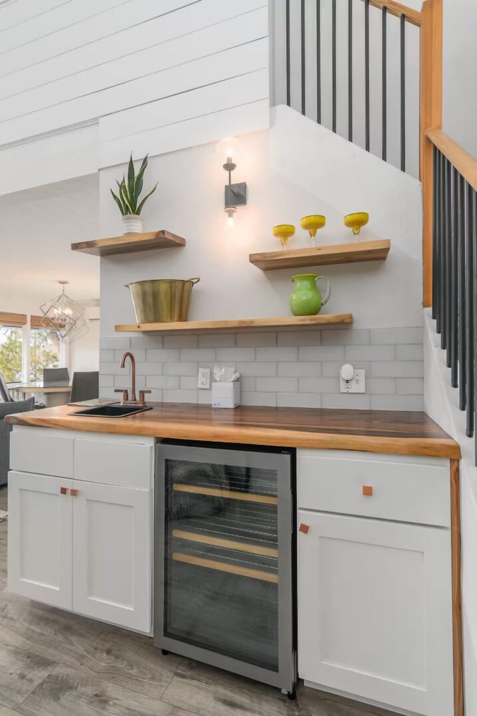 Charming mini kitchen with wine fridge and open shelving—ideal for snacks and drinks on the go.