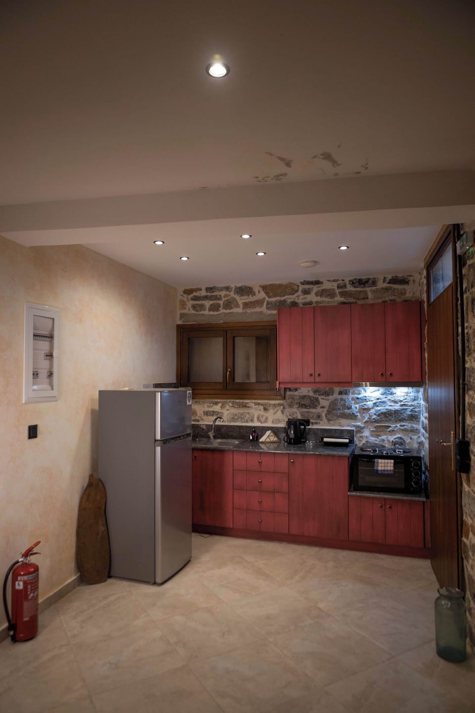 Kitchen Area with Dining Space and Stone Interior Details
