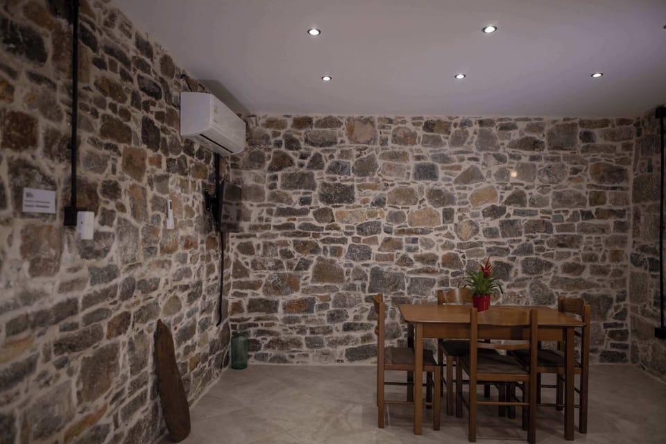 Cozy Dining Space with Stone Walls and Traditional Character