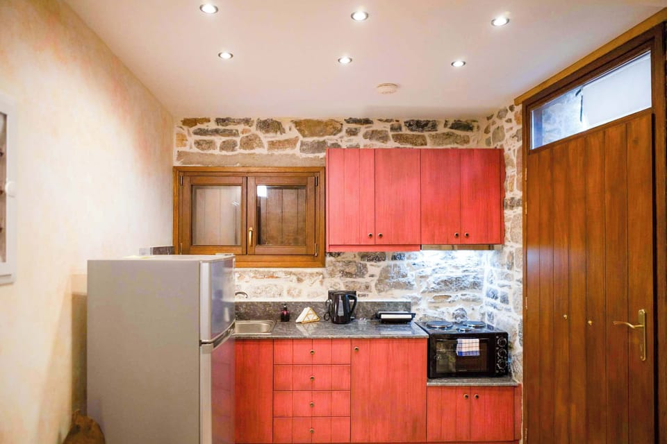 Fully Equipped Kitchen with Modern Appliances and Stone Design