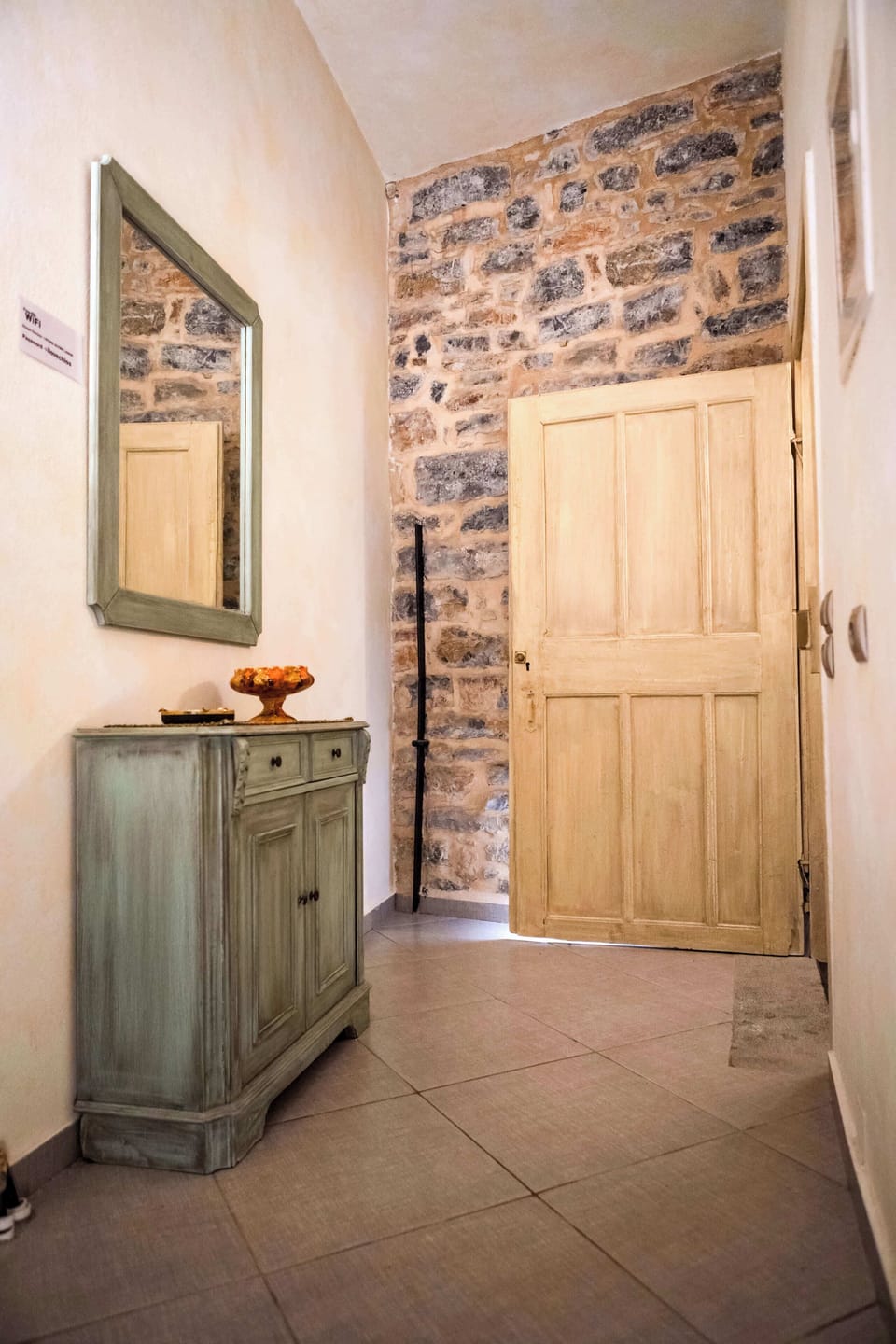 Entrance Corridor with Stone Walls and Rustic Character