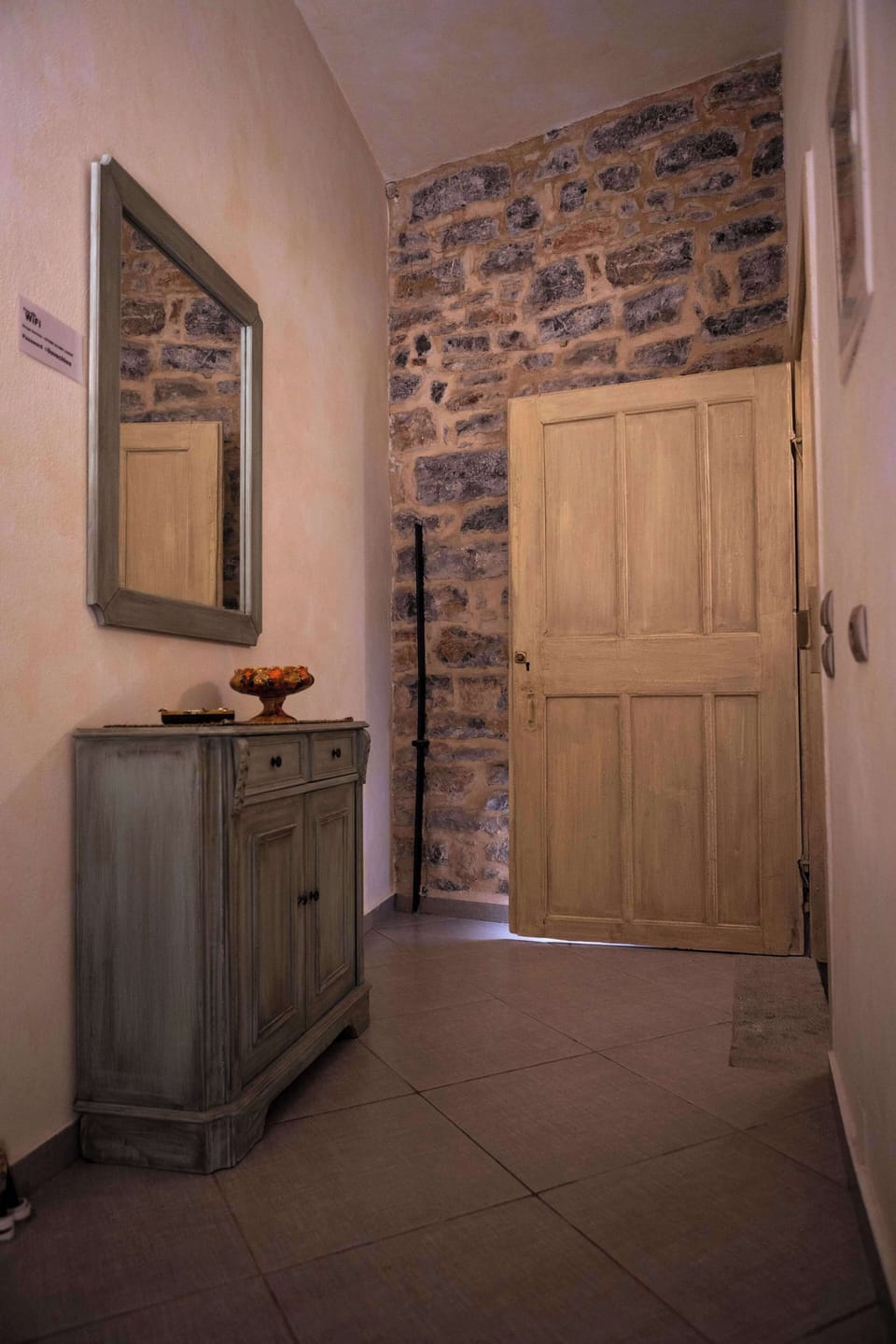 Entrance Corridor with Stone Walls and Rustic Character