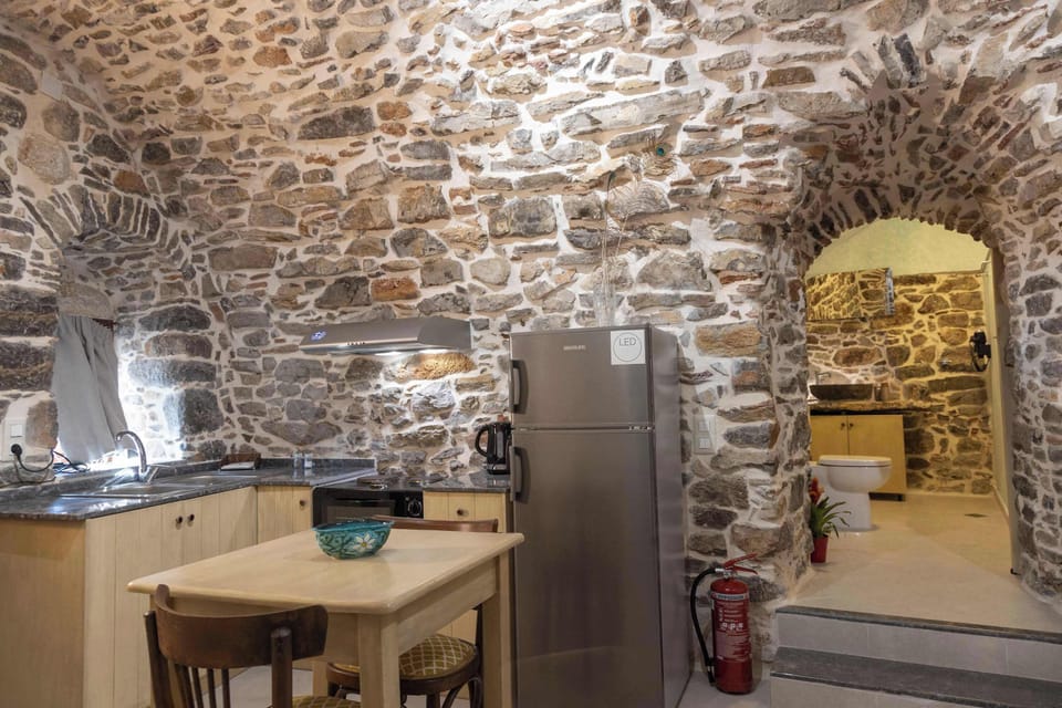 Kitchenette with Dining Table and Stone Interior Details