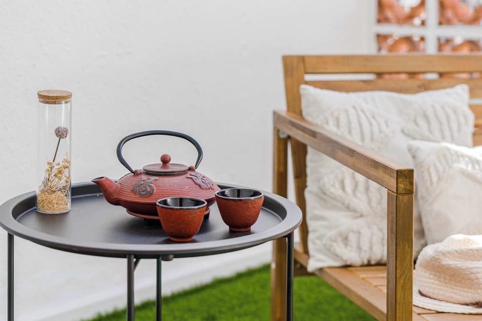 Sun-Kissed Terrace Chair with Soft Pillows — The Perfect Spot to Sip Tea, Read a Book, or Soak in the Peaceful Morning Light