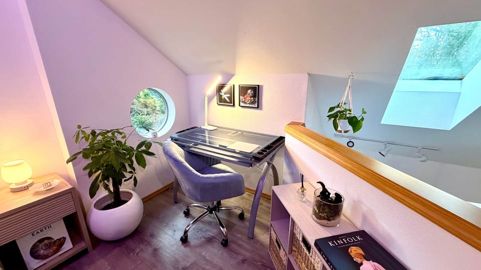 Stay productive at the dedicated workspace with fast Wi-Fi, natural light, and a unique round window