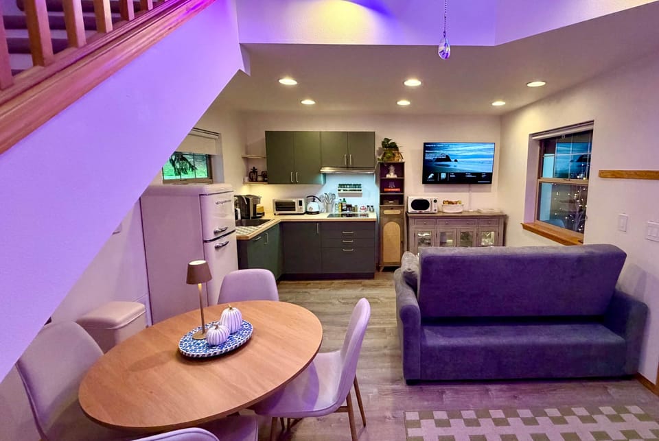 Enjoy meals at the cozy dining table for four, or cook in the fully equipped kitchenette.