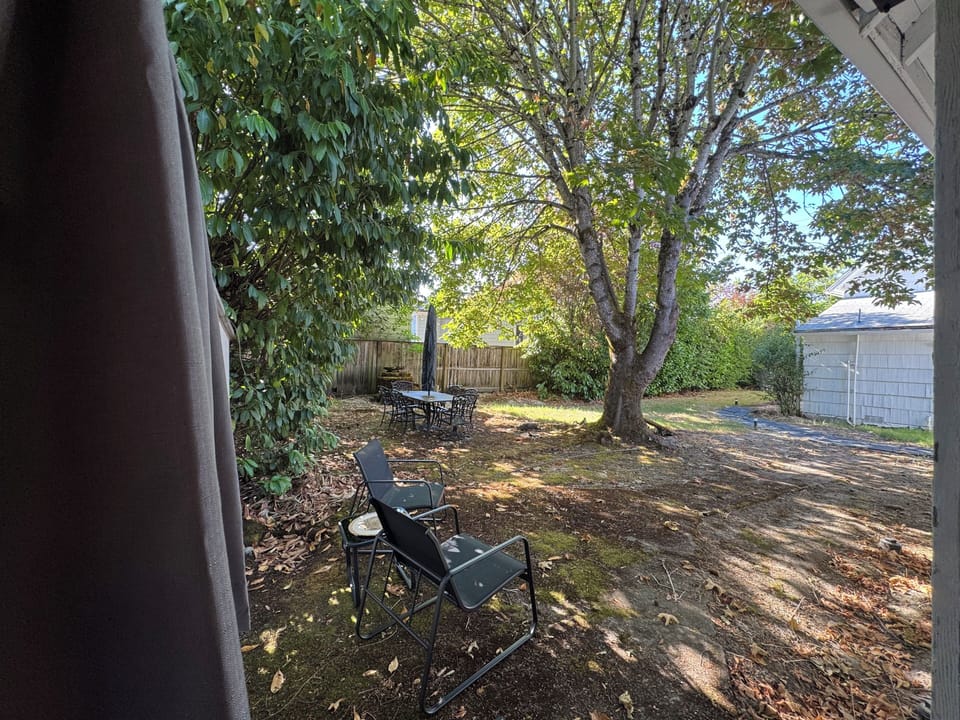Private backyard oasis. Relax with coffee or wine in the shade.