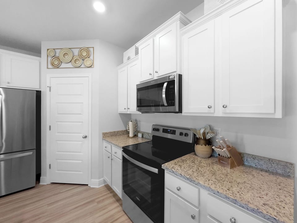 Full equipped kitchen with island and dining table seating.