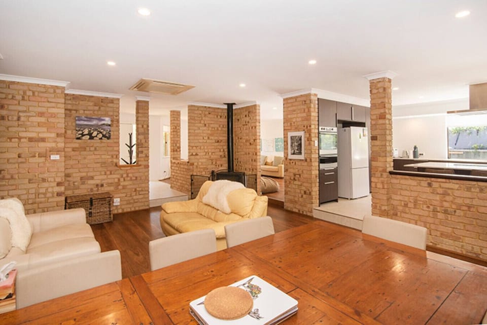 Living room, Dining area, Kitchen and Fireplace w/ Reverse-cycle Air-conditioning