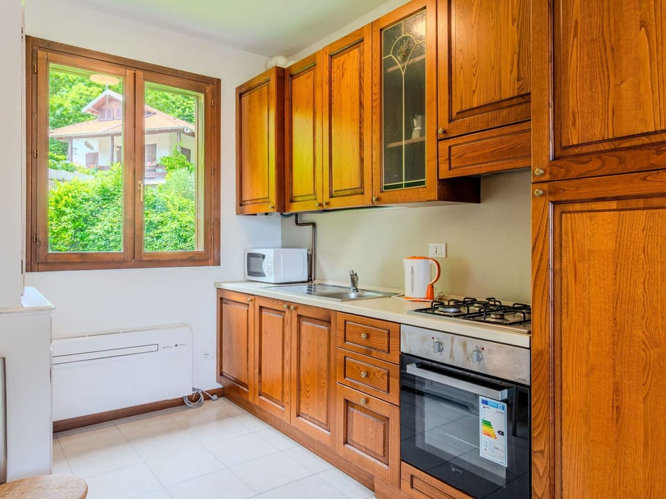 Wood, Cabinetry, Kitchen, Interior Design, Flooring, Countertop, Room, Kitchen Appliance, Major Appliance, Cupboard