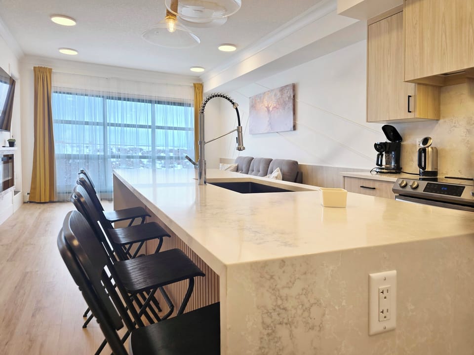 Dining area with island seating, perfect for meals and remote work