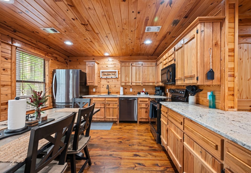 Outfitted with modern appliances and generous counter space, this kitchen makes preparing meals feel simple and enjoyable.