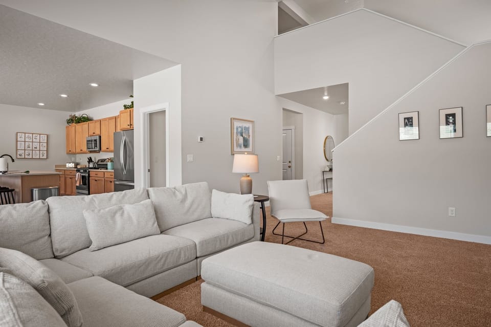 Rest easy upstairs with four inviting bedrooms, three well-appointed bathrooms, and a convenient laundry room for longer stays.