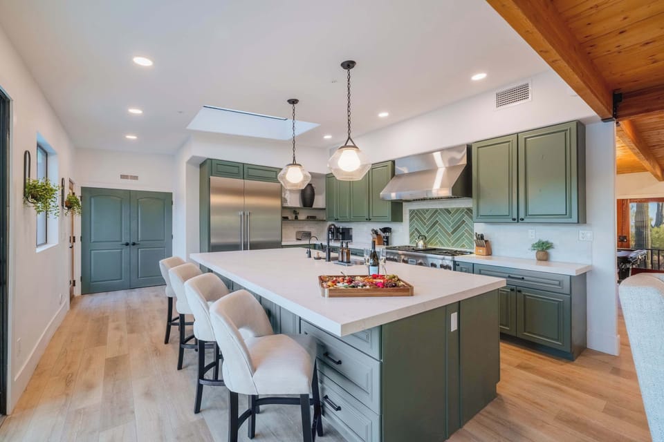 Spacious Kitchen Island & Seating - Gather around the oversized island with seating for the whole group. Whether it’s coffee at sunrise or cocktails before dinner, this space is made for connection.