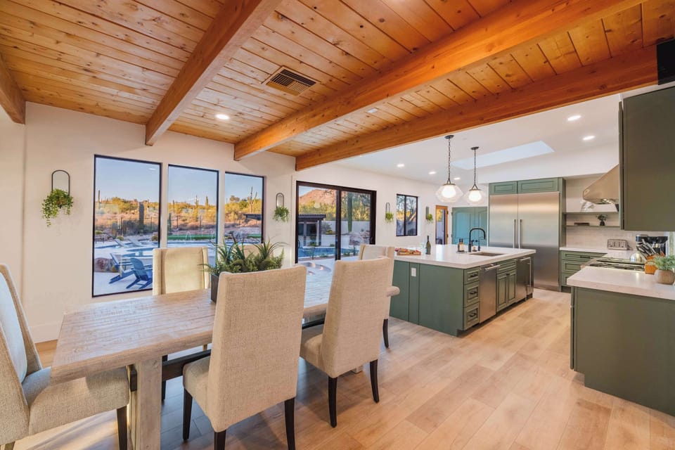 Open dining area with a rustic-modern wood ceiling and large windows that bring the desert landscape right to your table.