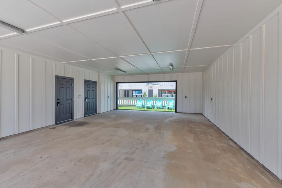 Spacious carport that will accommodate up to four midsize cars.