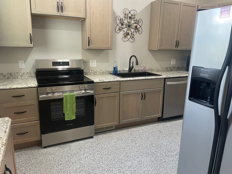 Clean and neat kitchen with all new cabinets and appliances.