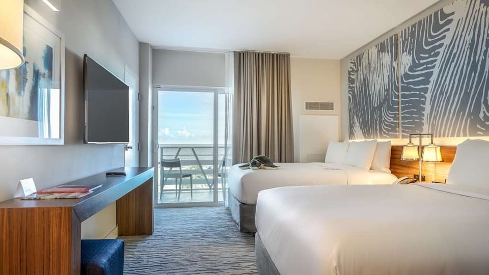 Step onto the balcony and breathe in salty ocean air.