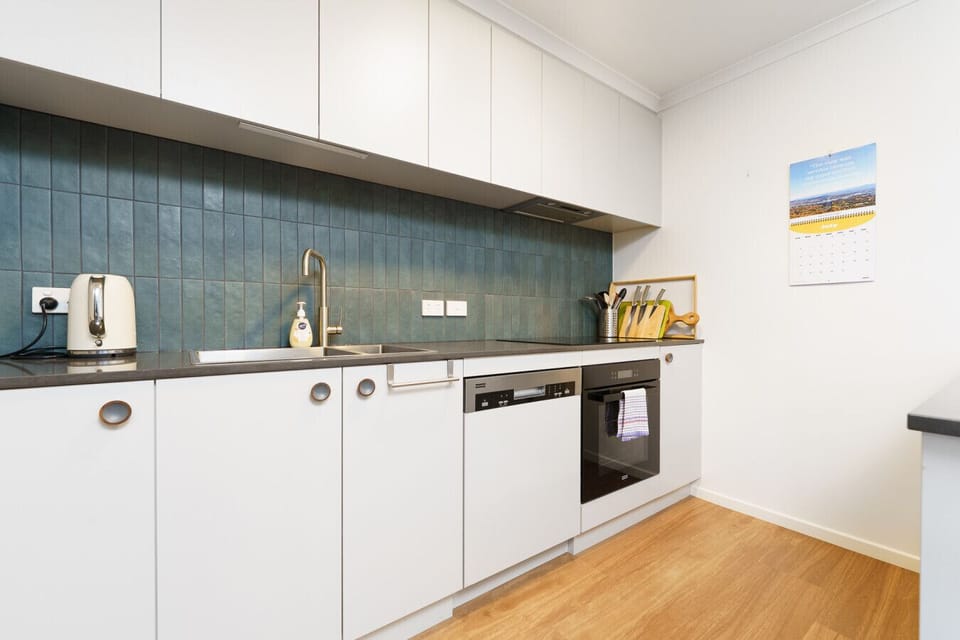 Cook, dine, and connect in a functional kitchen with modern appliances.