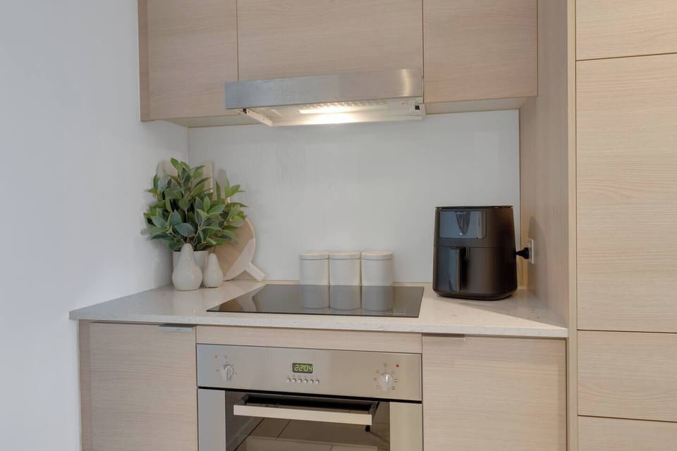 Prepare meals effortlessly in the compact yet efficient kitchen, complete with an oven, stovetop, air fryer and dishwasher.