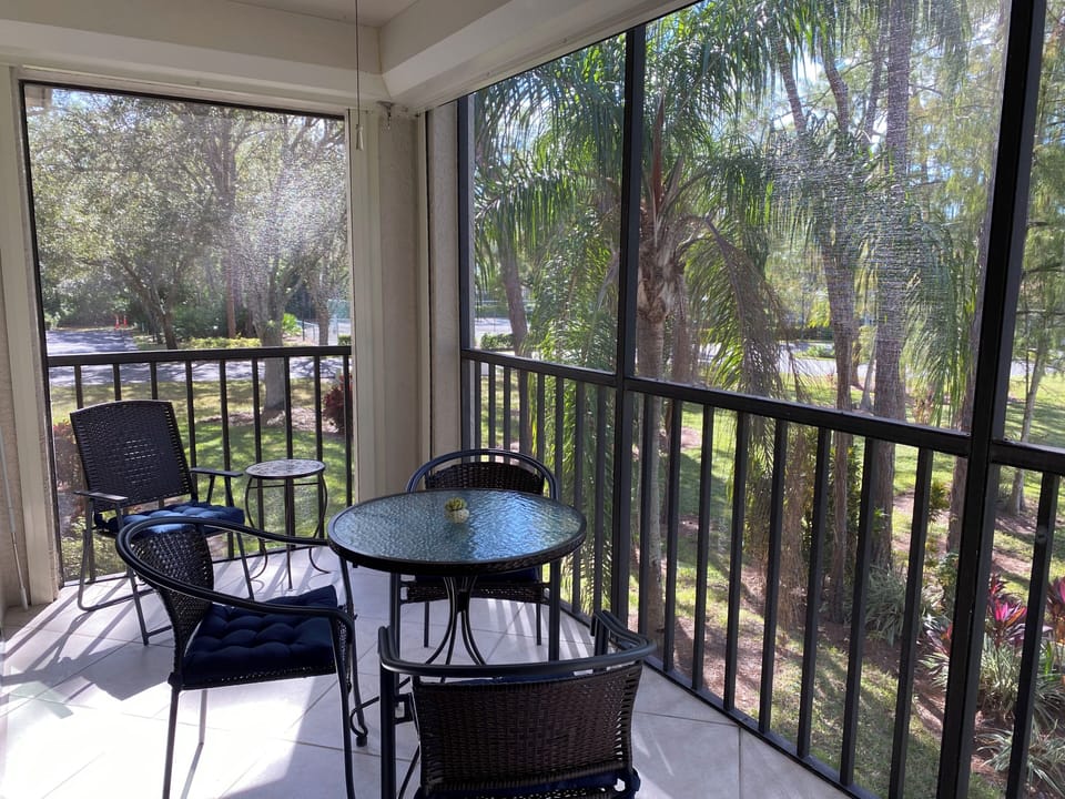 Two-sided screened-in lanai offers a refreshing breeze. 