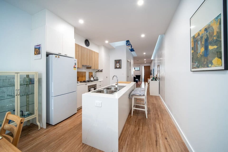Prepare meals with ease in the well-equipped kitchen, where generous bench space and modern appliances make shared meals simple.