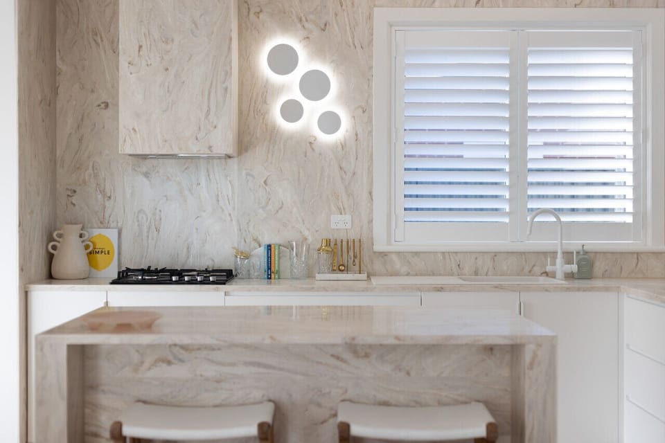Cook with ease in the marble kitchen, where clean lines meet thoughtful design.