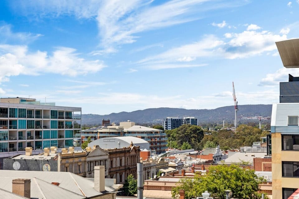 Take in uninterrupted views stretching from historic rooftops to the lush Adelaide Hills—your peaceful escape above the buzz of the East End.